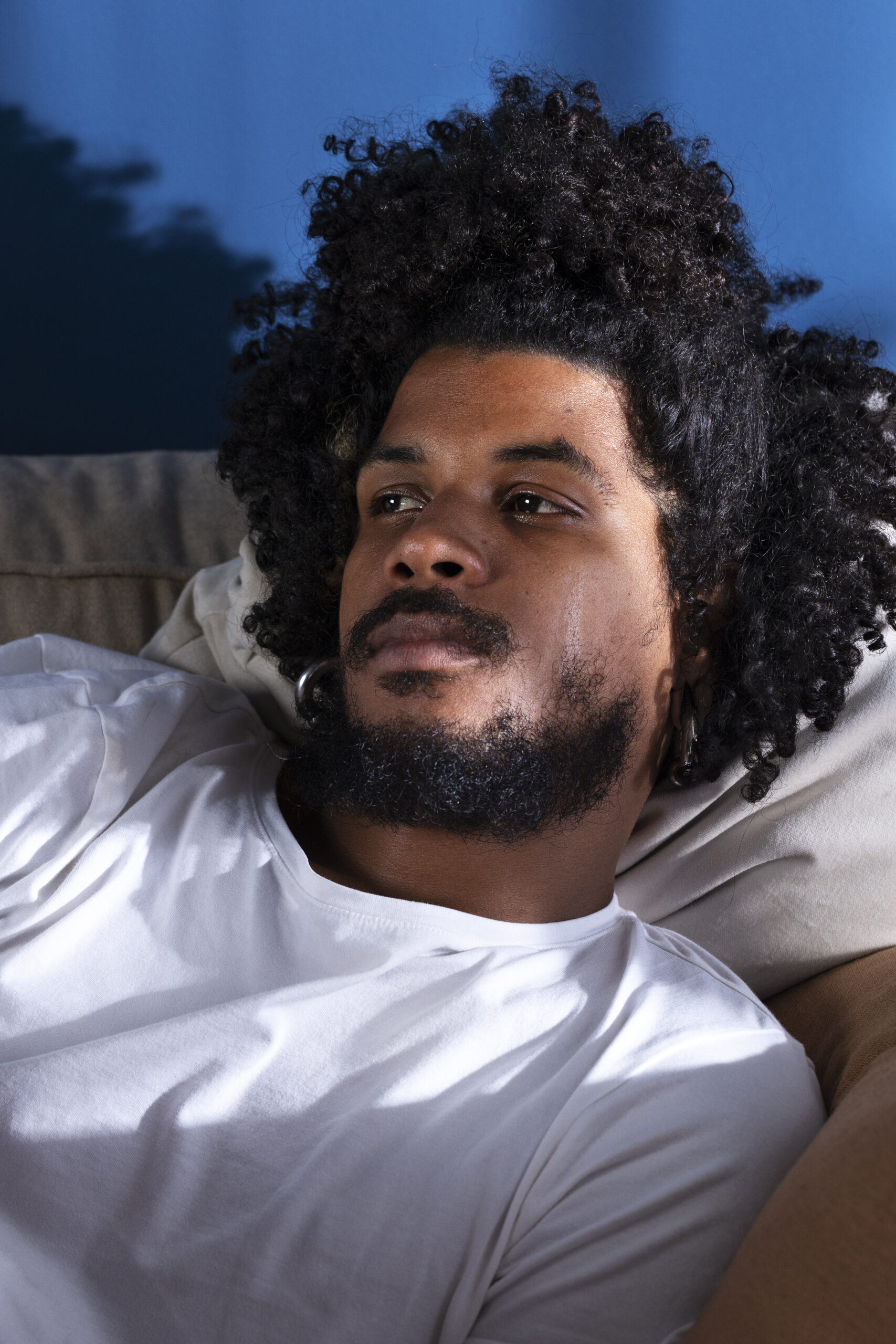 medium-shot-depressed-man-bed